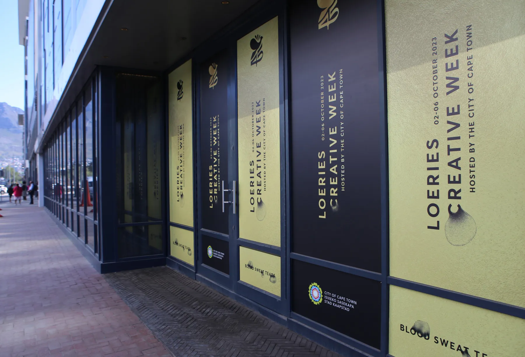 Creative Week branding along the venue windows